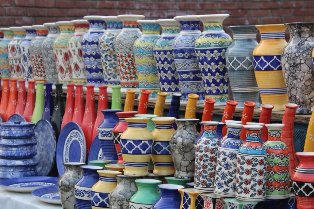Jaipur Souvenirs You Will Actually Want to Bring Home 2 Hand-painted ceramic vases and plates representing Jaipur blue pottery souvenirs