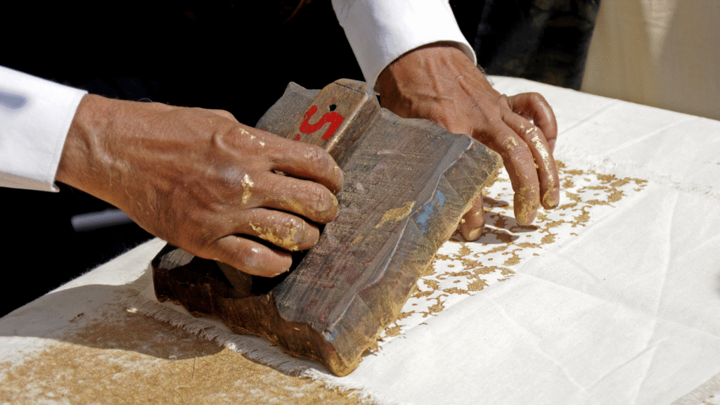 Discover Rajasthani Block Printing at Jaipur's Finest Textile Shops 3 Artisan practising hand printing on fabric in Jaipur with a wooden block