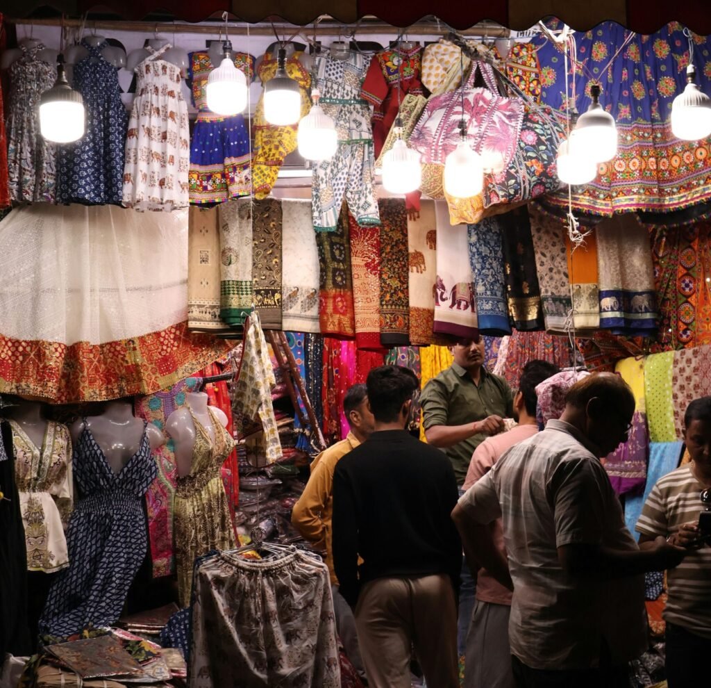 Jaipur Souvenirs You Will Actually Want to Bring Home 1 Colourful textiles displayed as Jaipur souvenirs at a market near Hawa Mahal
