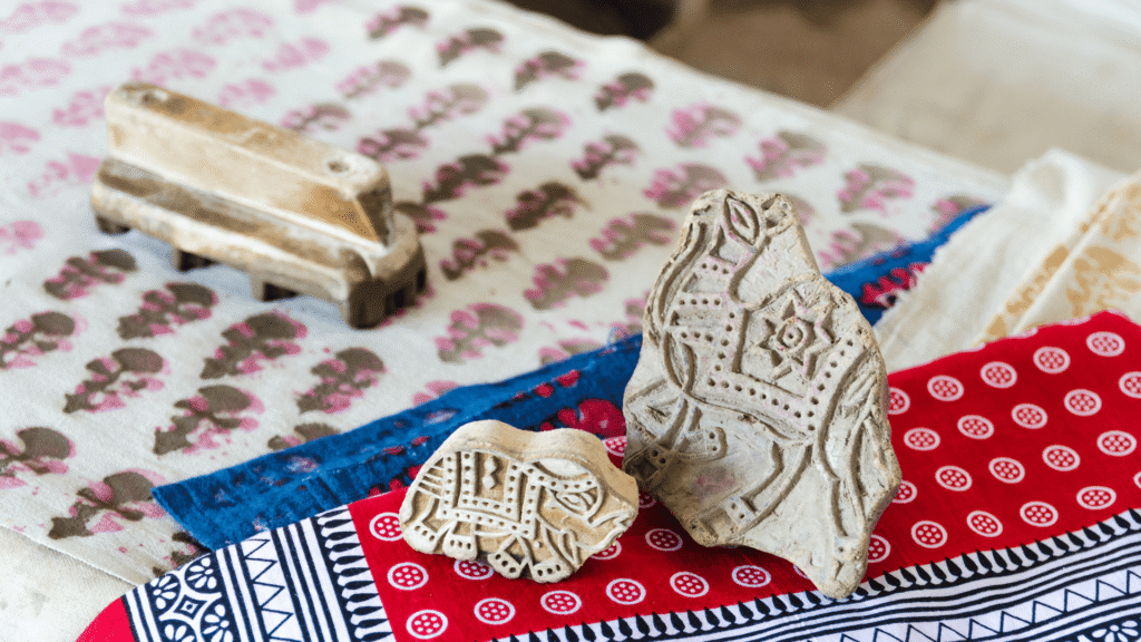 Rajasthani Textiles: Bandhani and Block Printing at Dera Mandawa 1 The image displays hand-carved wooden blocks used for traditional block printing on Rajasthani textiles.