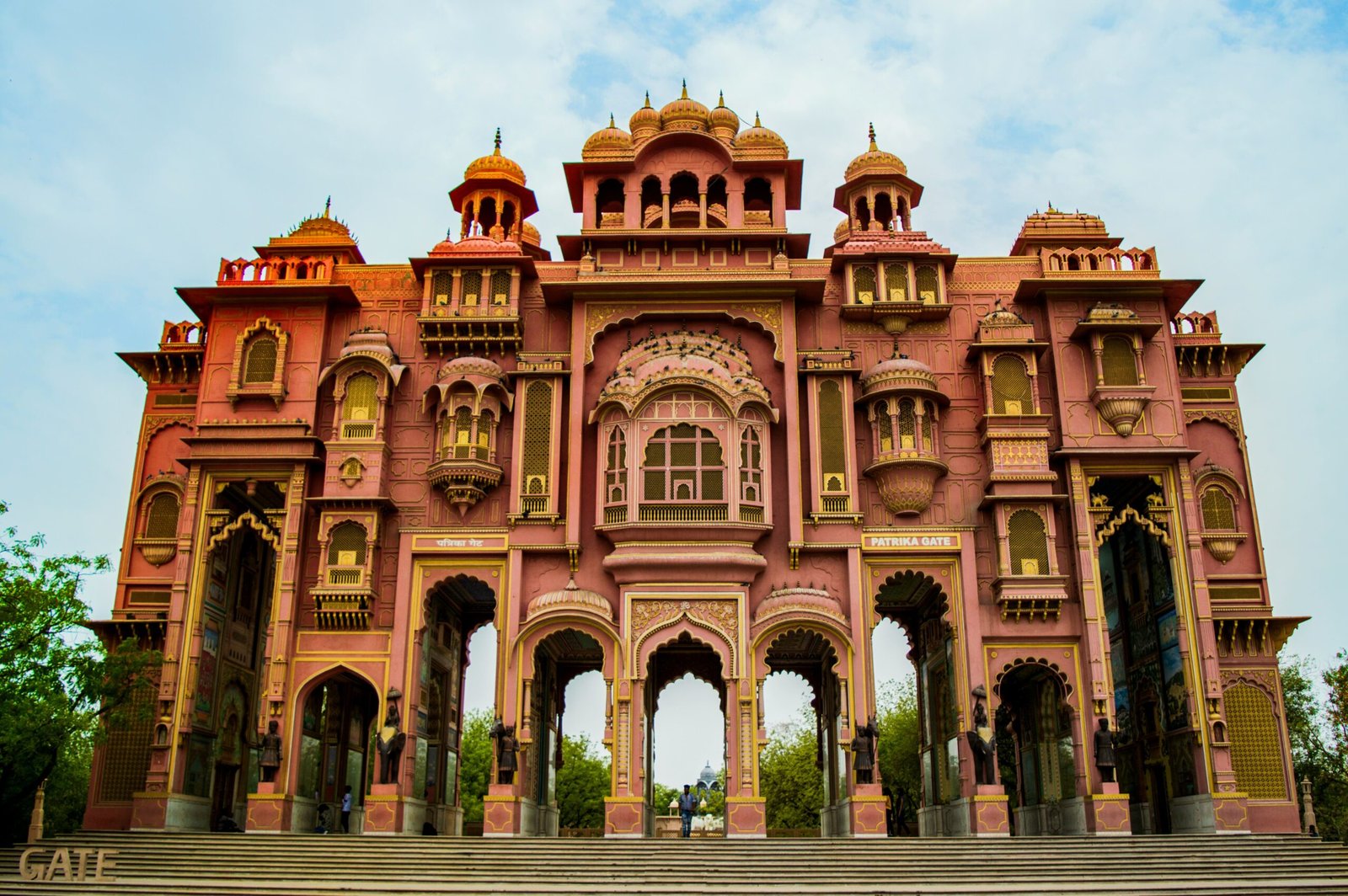 Patrika Gate located in Jaipur, India. a vibrant gateway that serves as an entrance to the Jawahar Circle Garden | Dera Mandawa