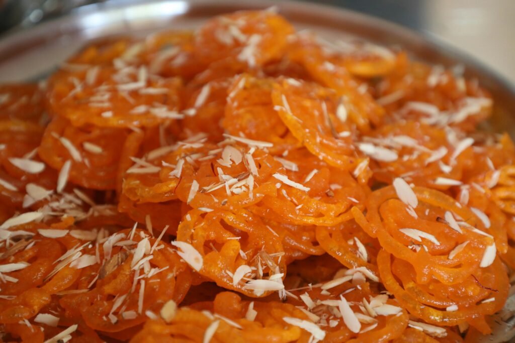 Deciphering the Nuances of Saffron and Silver Leaf in Traditional Rajasthani Sweets 3 Jalebi, a popular Rajasthani Sweet made from deep-fried maida batter Rajasthani Sweets