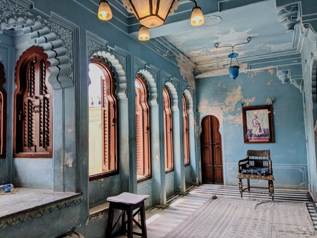 How Haveli Architecture Was Designed for the Jaipur Heat 1 City Palace in Udaipur, India, showcasing traditional Rajput architecture and pastel blue walls.