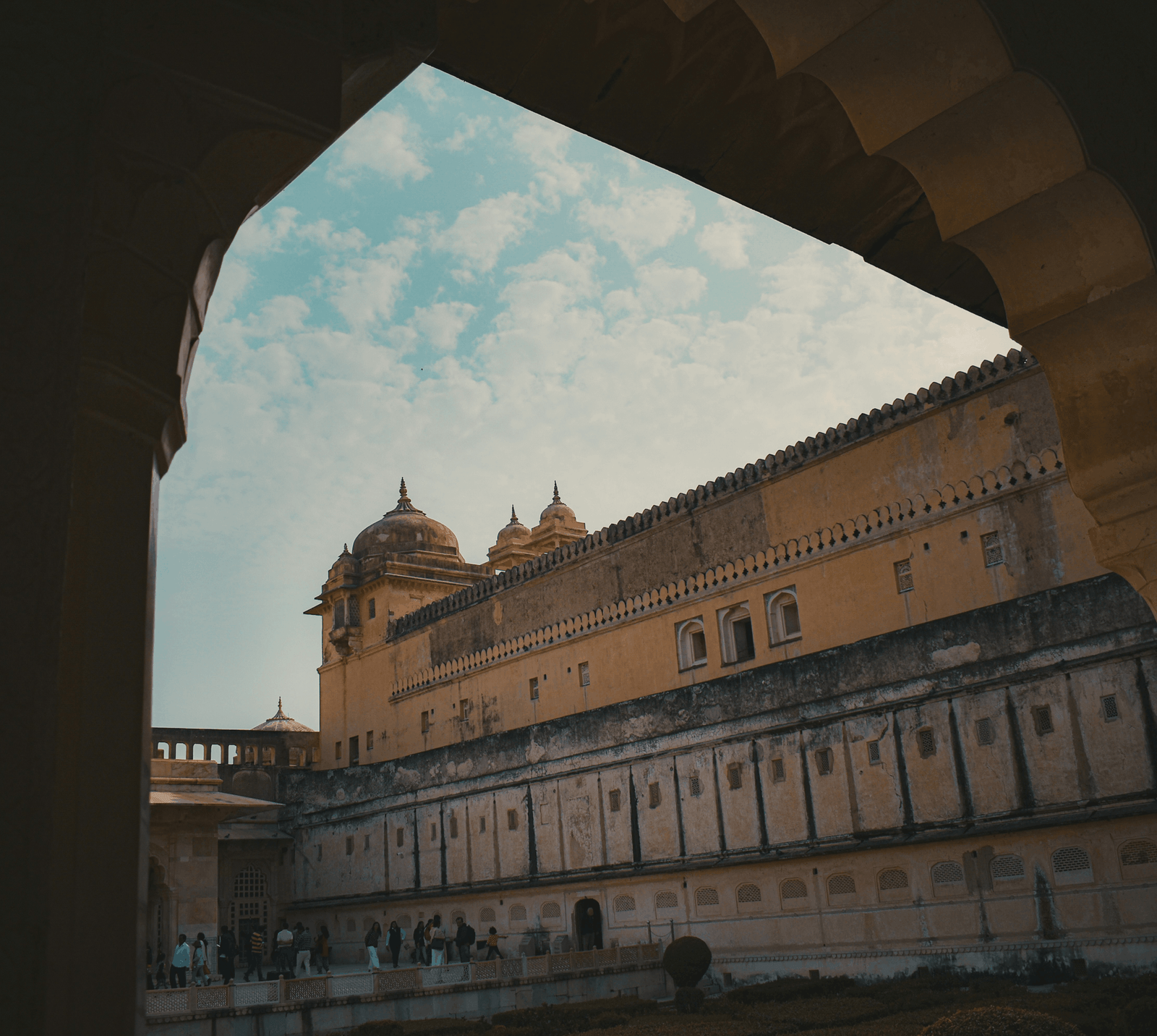 Bagru 13 A view from a window overlooking the sandstone ramparts and domes of the historic Amber Fort in Jaipur.