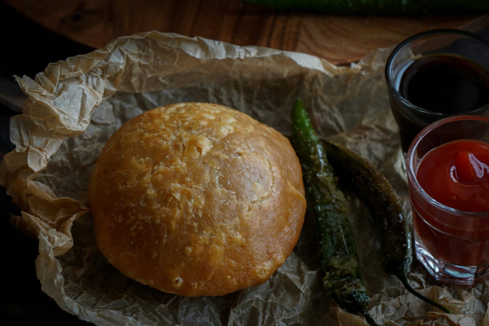 Famous Jaipur pyaaz kachori served with chutneys and fried green chillies