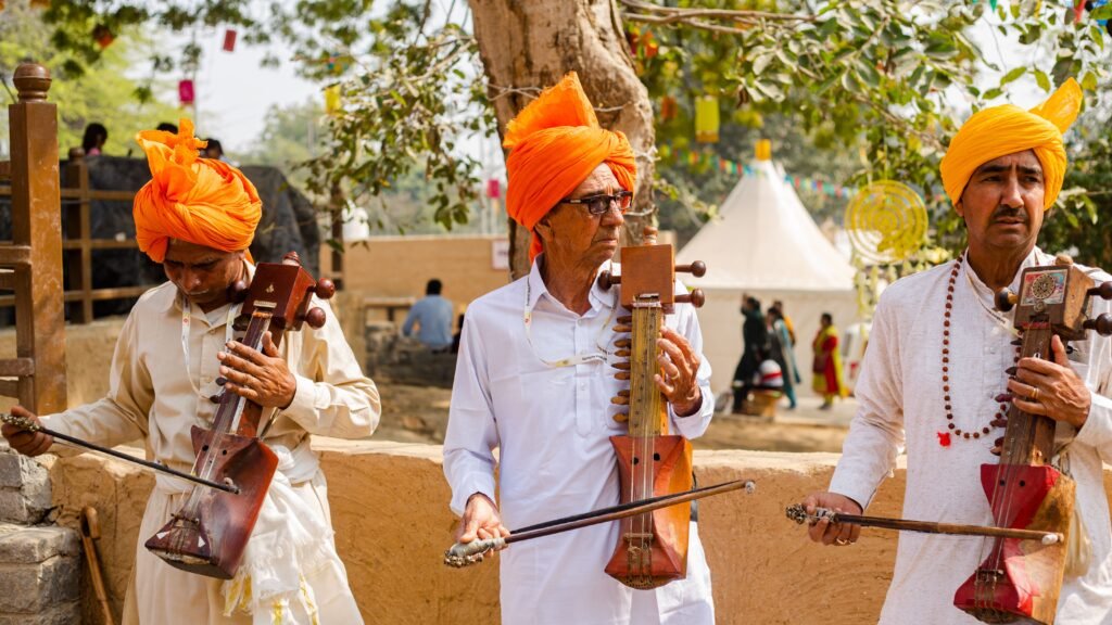 Ghoomar Dance in Jaipur: The Tradition Behind the Festival 3 Rajasthani folk musicians playing traditional instruments during a cultural festival