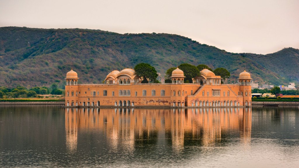 Your Photoshoot Deserves More Than a Fort Gate 1 the roadside view across the water to Jal Mahal | pre-wedding shoot locations in Jaipur